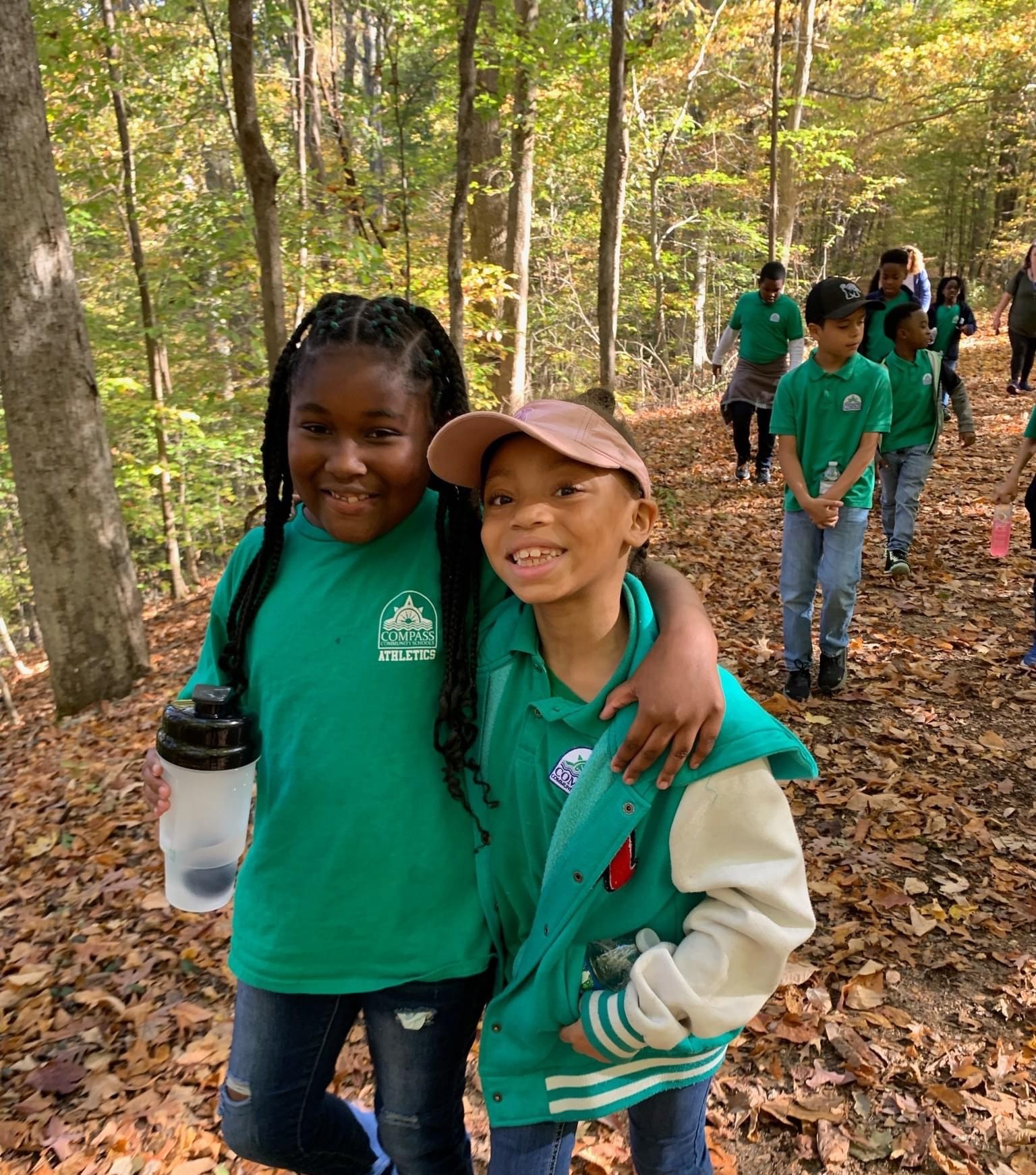 Group of kids smiling, hiking at Meeman-Shelby Forest State Park.